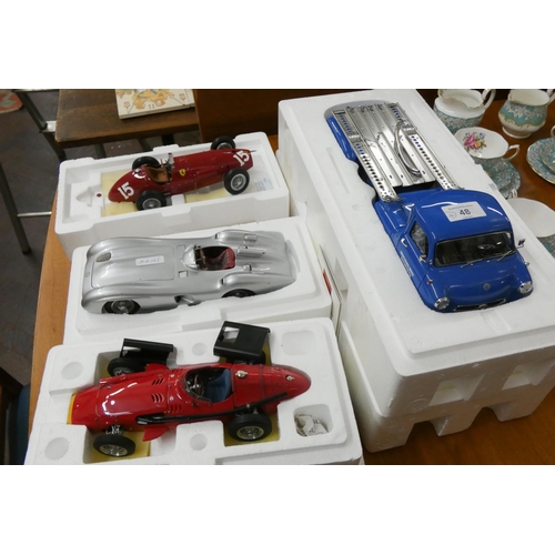 48 - Two model racing cars, a sports car a Mercedes transporter truck