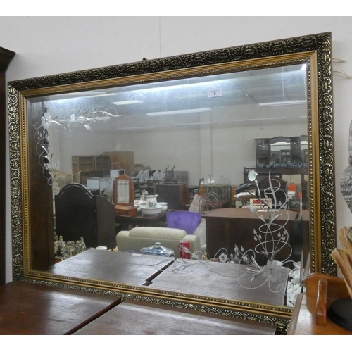 5 - A large gilt framed bevelled wall mirror etched with flowers