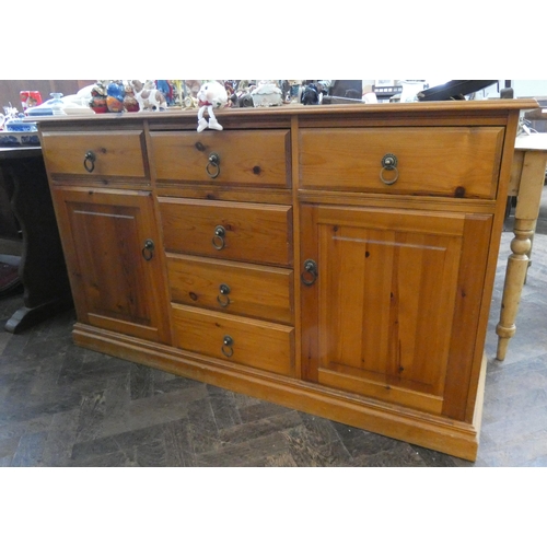 58 - A modern pine sideboard fitted cupboards and six drawers, 4'9 wide