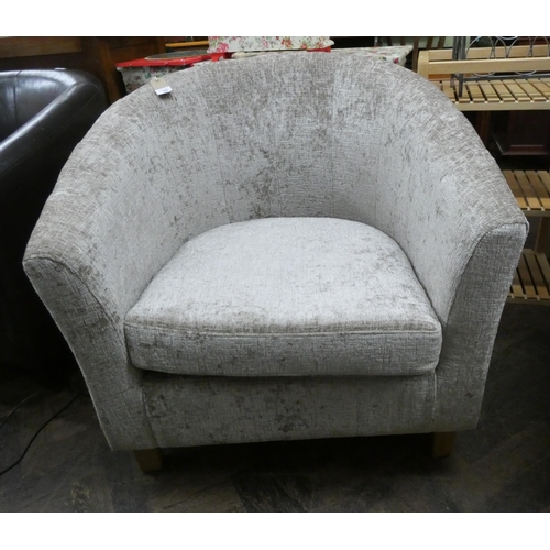 75 - A modern tub shaped easy chair in fawn covering