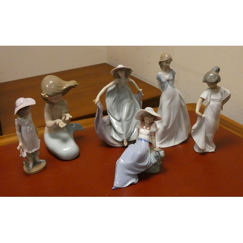 86 - A collection of Nao and Lladro porcelain figurines (Five Nao and one Lladro)