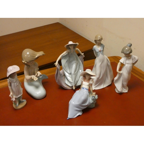 86 - A collection of Nao and Lladro porcelain figurines (Five Nao and one Lladro)