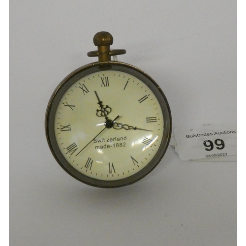 99 - A bullseye glazed brass ball clock