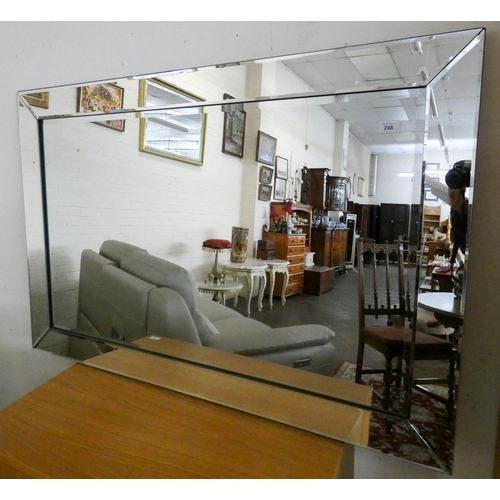 248 - A large frameless wall mirror, 48