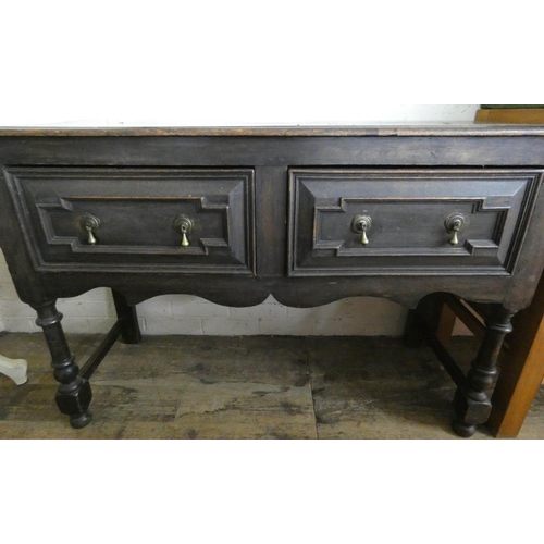 250 - An oak plank topped sideboard fitted two drawers on turned legs, 4' wide