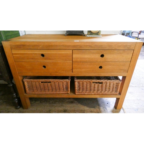 251 - A modern light oak kitchen chest fitted four drawers and two pull out wicker baskets, 4' wide