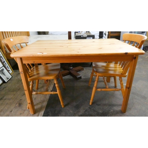 254 - A modern pine dining or kitchen table, 4' X 2'6 and two spindle back Windsor dining chairs