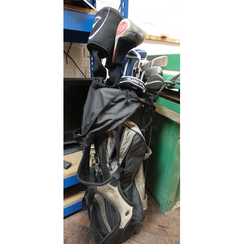 364 - A set of Mazuno golf clubs in carrying bag and some old woods