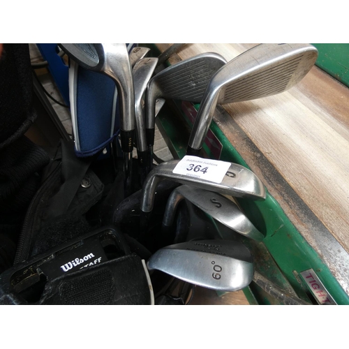 364 - A set of Mazuno golf clubs in carrying bag and some old woods