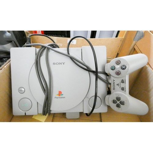 377 - A Sony PlayStation with controller