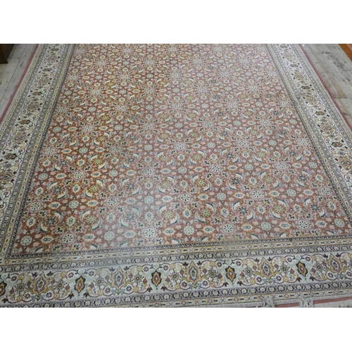 103 - A red and patterned Wilton carpet, 11'6 x 8'3