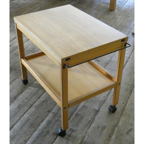 100 - A modern pine two tier tea trolley opening to a table