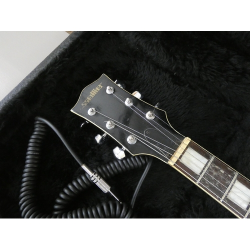 111 - A Satellite six string electric guitar in a freestyle travelling case