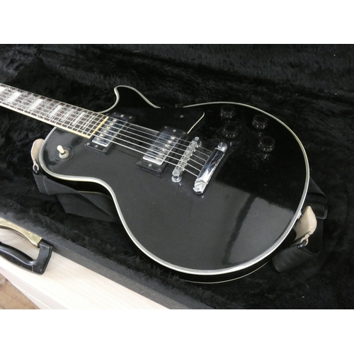 111 - A Satellite six string electric guitar in a freestyle travelling case