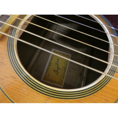 115 - An Angelica six string acoustic guitar in hard carrying case