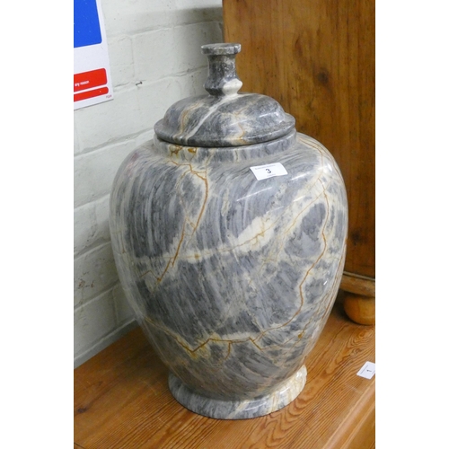 3 - A grey and figured marble urn with lid, approximately 18