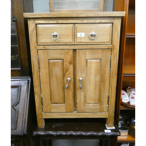 38 - A small stripped oak cupboard fitted two drawers, 21