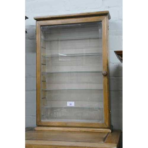 39 - A small wall hanging stripped oak glazed display cabinet with interior shelves, 15 1/2