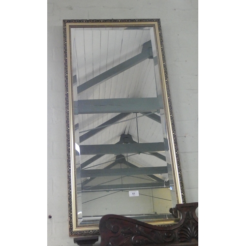 61 - A long bevelled wall mirror in gilt frame