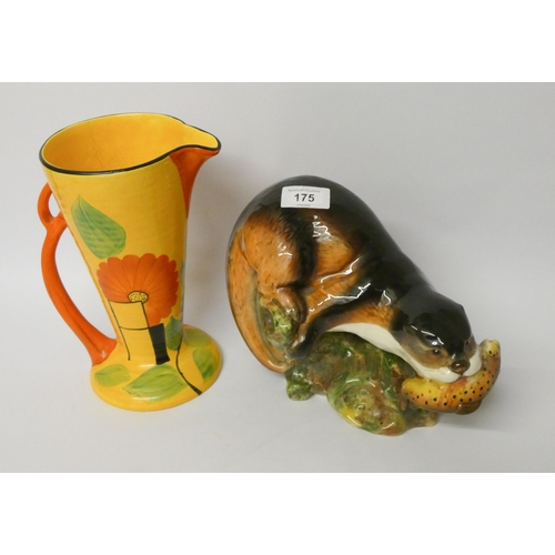 175 - An Art Deco flower painted jug and a Sylvac model of an otter