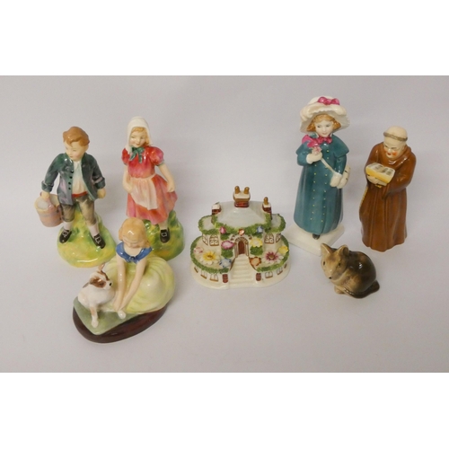 176 - A collection of four Royal Doulton lady figures, a Worcester friar candle snuffer, Poole pottery mou... 