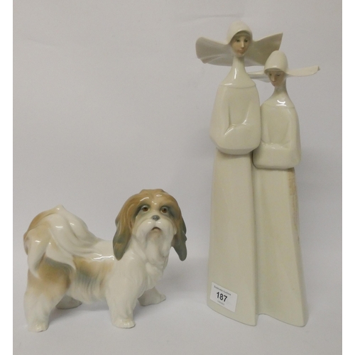 187 - Lladro - A pair of Nuns and a Lladro figure of a terrier dog