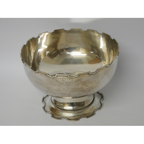 500 - A large Mappin & Webb silver Monteith bowl with a crenelated edge and pedestal foot, Birmingham hall... 