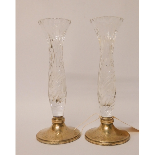 503 - A pair of cut glass specimen vases with hallmarked silver bases, 21cms tall