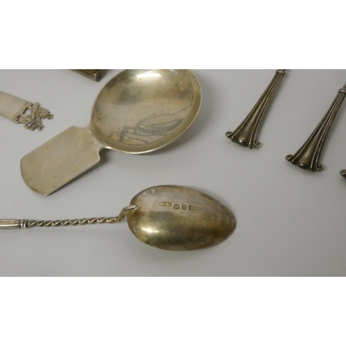 509 - A hallmarked silver toast rack, various small silver spoons, caddy spoon and a vintage wristwatch, w... 