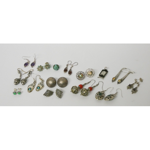 563 - A large number of pairs of modern silver ladies drop earrings set with assorted stones.