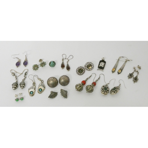 563 - A large number of pairs of modern silver ladies drop earrings set with assorted stones.