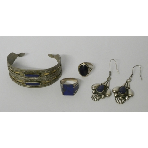 571 - A lapis set bangle, a pair of lapis and silver drop earrings and two dress rings