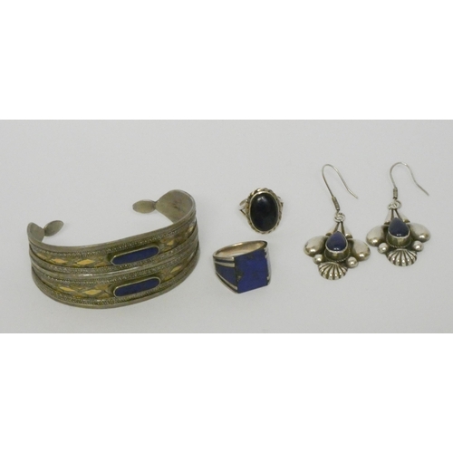 571 - A lapis set bangle, a pair of lapis and silver drop earrings and two dress rings