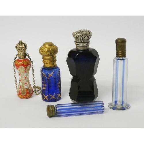 518 - A collection of Victorian glass scent bottles to include: pretty enamelled hour glass shaped bottle ... 