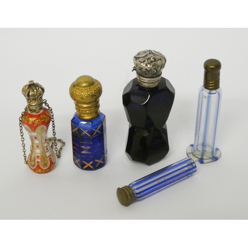 518 - A collection of Victorian glass scent bottles to include: pretty enamelled hour glass shaped bottle ... 