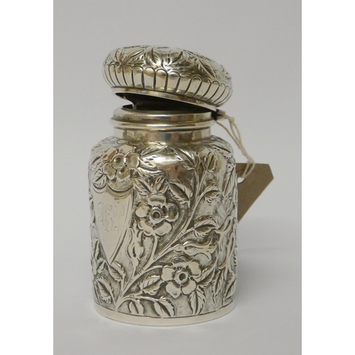 530 - A Victorian silver  eau de toilette bottle with embossed floral decoration,  with glass liner and gr... 