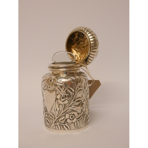 530 - A Victorian silver  eau de toilette bottle with embossed floral decoration,  with glass liner and gr... 