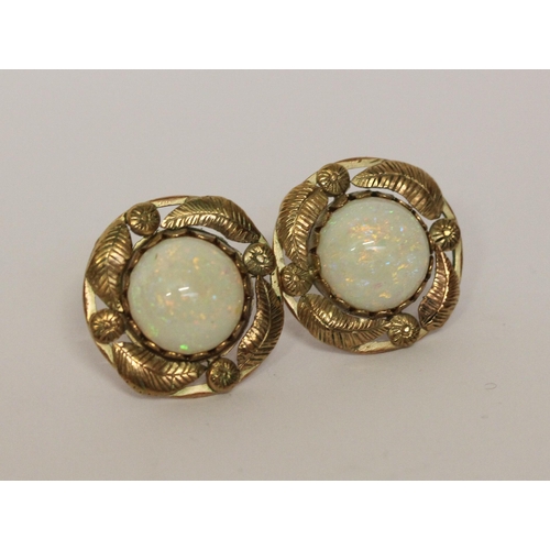 586 - A pair of opal circular stud fitting earrings in unmarked yellow metal, each earring 20mm across