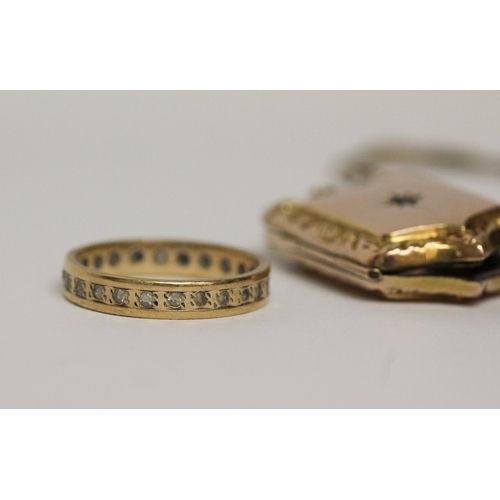 591 - 9ct gold stone set eternity ring, scrap 9ct necklace and a 9ct gold front and back locket