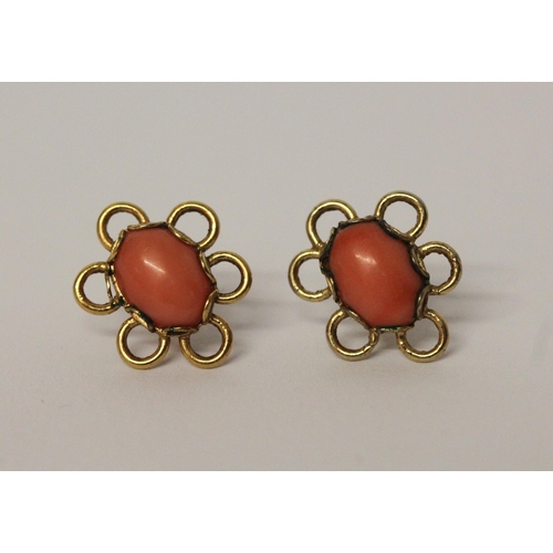 595 - A pair of oval coral stud fitting earrings