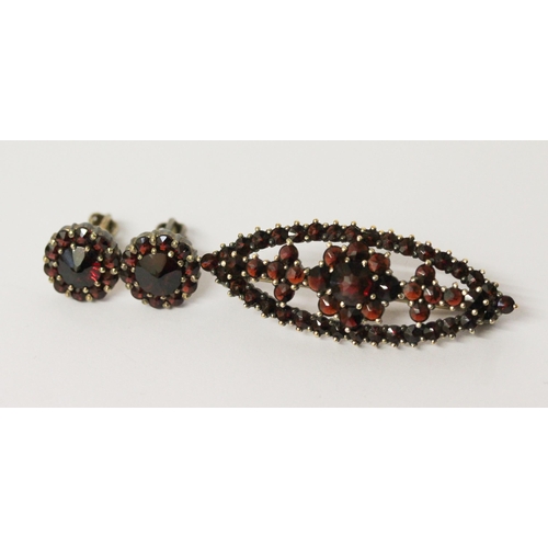 610 - Bohemian garnet lozenge shaped brooch, in silver gilt marked G 900 and a pair of garnet cluster stud... 