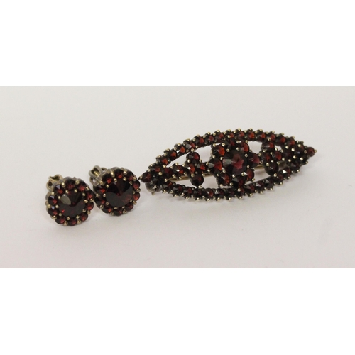 610 - Bohemian garnet lozenge shaped brooch, in silver gilt marked G 900 and a pair of garnet cluster stud... 