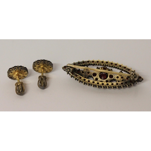 610 - Bohemian garnet lozenge shaped brooch, in silver gilt marked G 900 and a pair of garnet cluster stud... 