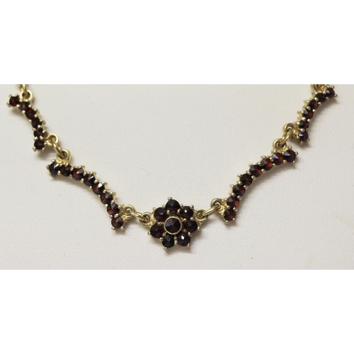 611 - 9ct yellow gold and garnet cluster pendant necklace, gross weight 6.1 gms