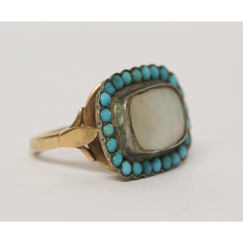 620 - An antique turquoise and mother of pearl panel ring, the closed back rectangular setting to a simple... 