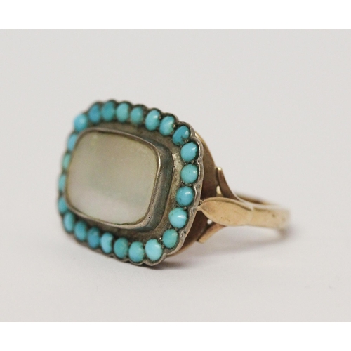 620 - An antique turquoise and mother of pearl panel ring, the closed back rectangular setting to a simple... 