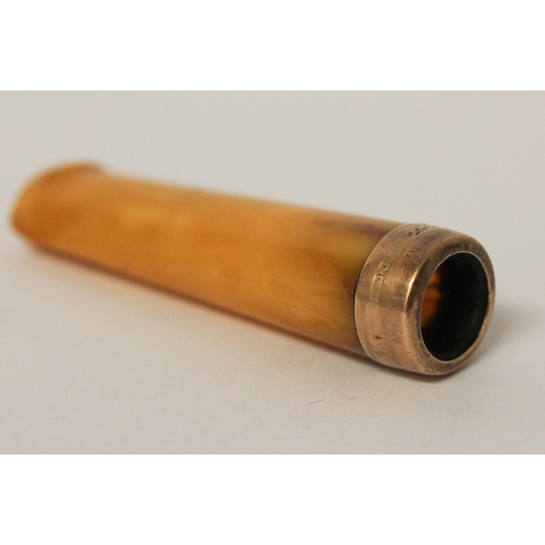 651 - An Amber and 9ct gold mounted cheroot holder