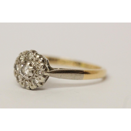 664 - Vintage diamond cluster ring, on 18ct gold band, marked 18ct & Plat, ring size J/K