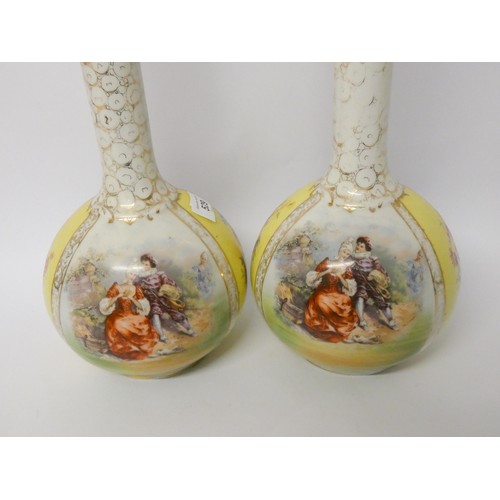 193 - A pair of Austrian porcelain bottle necked vases and covers, decorated with transfer printed pastora... 