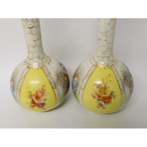 193 - A pair of Austrian porcelain bottle necked vases and covers, decorated with transfer printed pastora... 